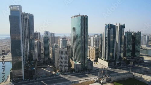 A camera drone flies by high-rise apartment complexes and hotels in Alfateh District of Manama, Bahrain