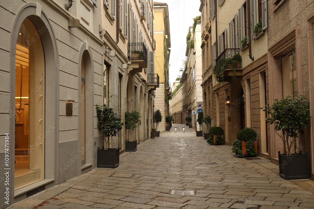 Fototapeta premium A glimpse of Via della Spiga on an early Sunday morning, the only time frame in the week not crowded with enthusiastic , hectic and busy people on the street