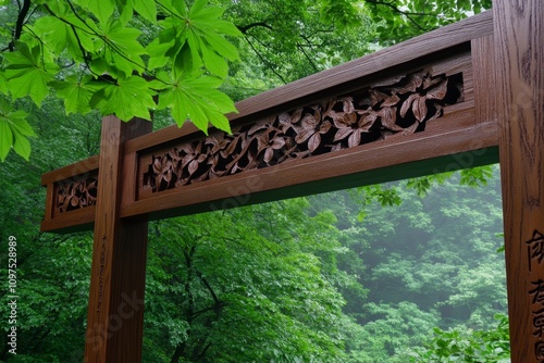 Asian temple gate shrouded in morning mist, with towering wooden beams and intricate detailing photo