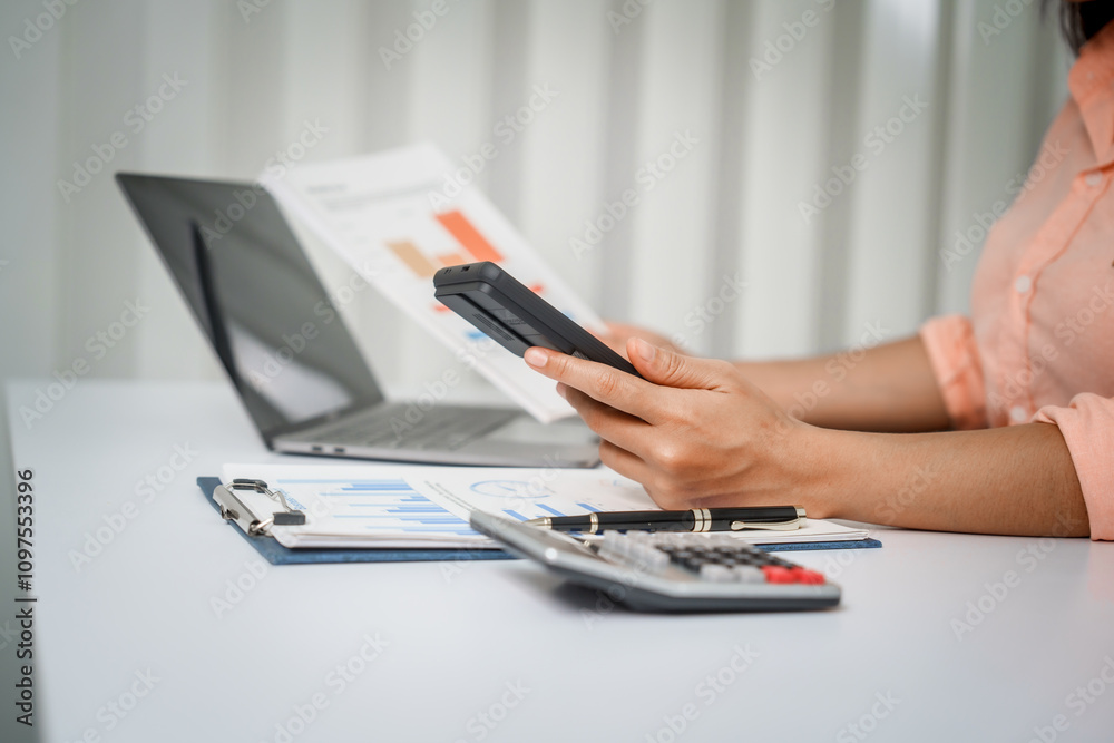 A close-up of a businesswoman working on a laptop in an office. As an accountant, she records financial data, verifies documents, manages income and expenses, ensuring accurate financial reporting A close-up of a businesswoman working on a laptop in an office. As an accountant, she records financial data, verifies documents, manages income and expenses, ensuring accurate financial reporting