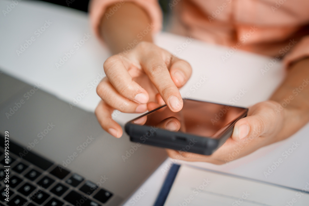 A close-up of a businesswoman working on a laptop in an office. As an accountant, she records financial data, verifies documents, manages income and expenses, ensuring accurate financial reporting A close-up of a businesswoman working on a laptop in an office. As an accountant, she records financial data, verifies documents, manages income and expenses, ensuring accurate financial reporting
