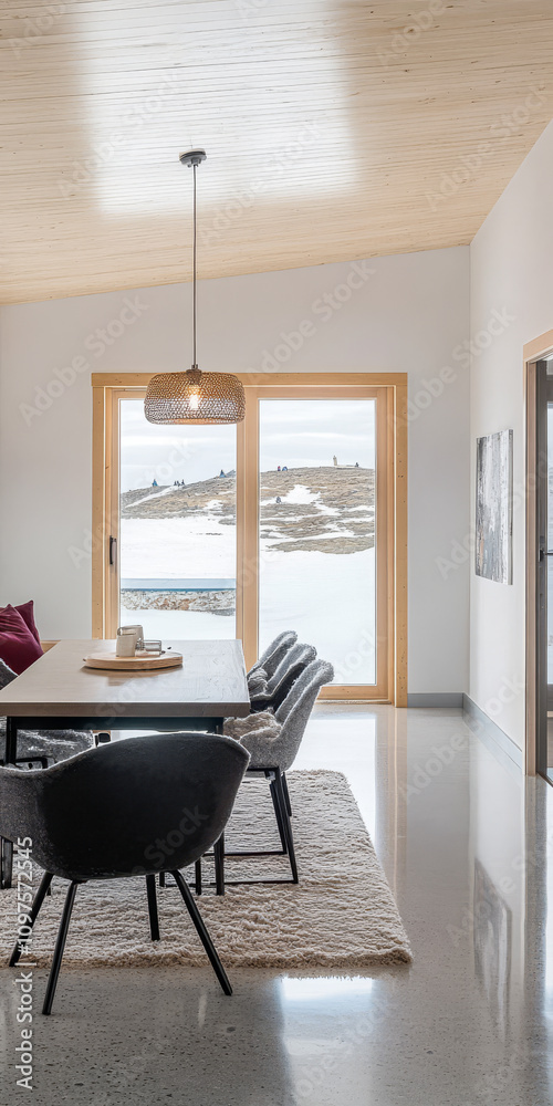 Fototapeta premium Contemporary dining space with mountain view and natural light in a modern home