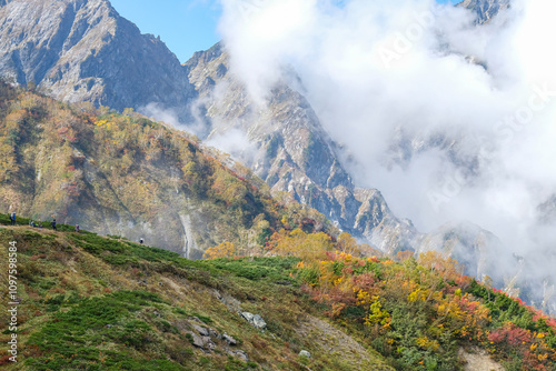 Happo Alpen Line Nature trail, Hakuba, Nagano, Japan, Mountain scenery with colorful foliage and clouds photo