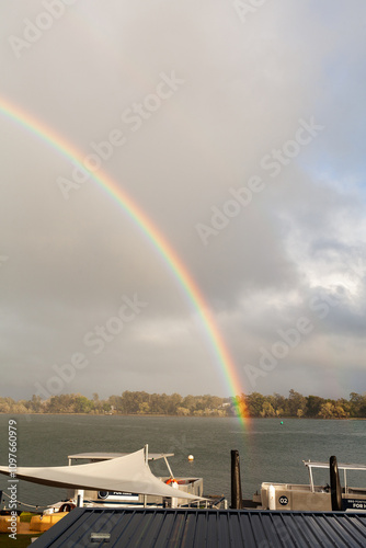 rainbow glowing in morning light over Hastings River in Port Macquarie