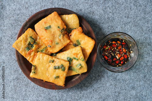 Tempe mendoan is a type of fried food from Indonesian with sweet soy sauce and sliced cayenne pepper