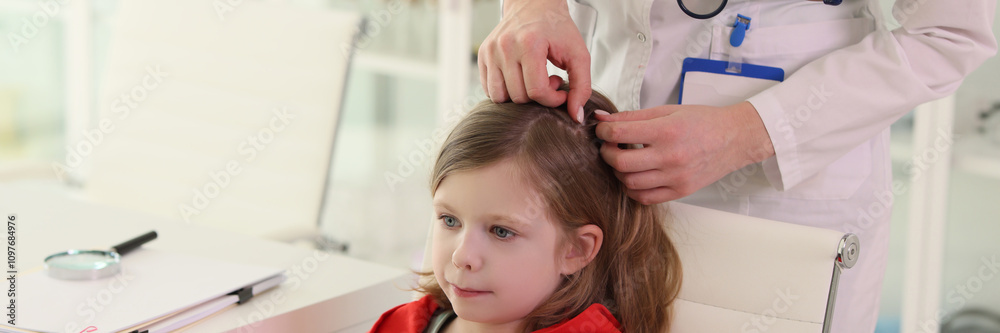 Therapist looks for insects in hair of little girl client