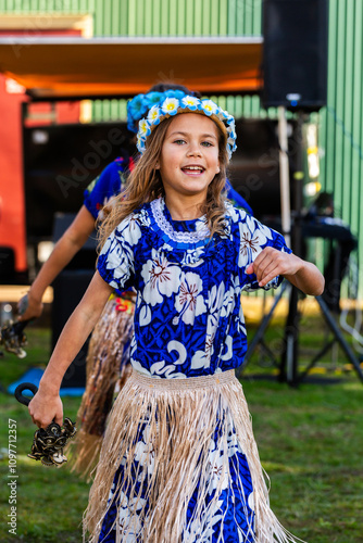 Young Torres Strait Island girl dancing in dance troop at NAIDOC event performance photo