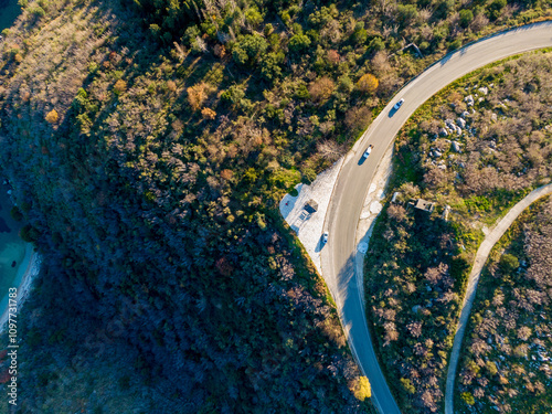 Aerial drone photo of road next to port and fishing village of Kouloura 
 port ,Corfu island, Ionian, Greece