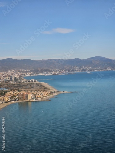 Spain, October 09, 2024: High flight in the mountains of the spanish coast. Aerial drone view to the cities, seaside and mountains. Beautiful landscape from the clouds.