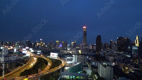 Wallpaper Mural BANGKOK, THAILAND - AUGUST 2024 : Aerial high angle view of Bangkok city at night. View of buildings and streets around downtown Siam area. Torontodigital.ca