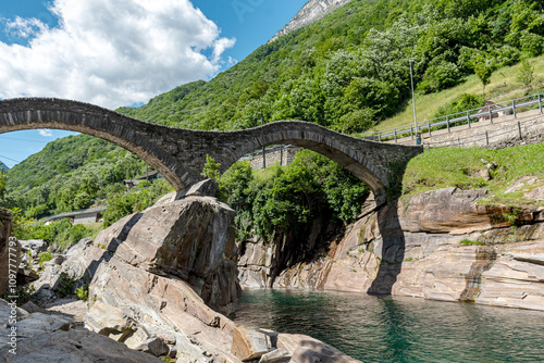 arched bridge over the river, historic bridge, green landscape from summe photo