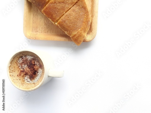 Sweet martabak served with a cup of coffee on a white background photo