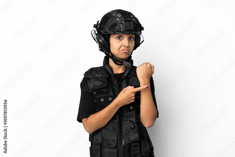 SWAT woman isolated on white background making the gesture of being late SWAT woman isolated on white background making the gesture of being late