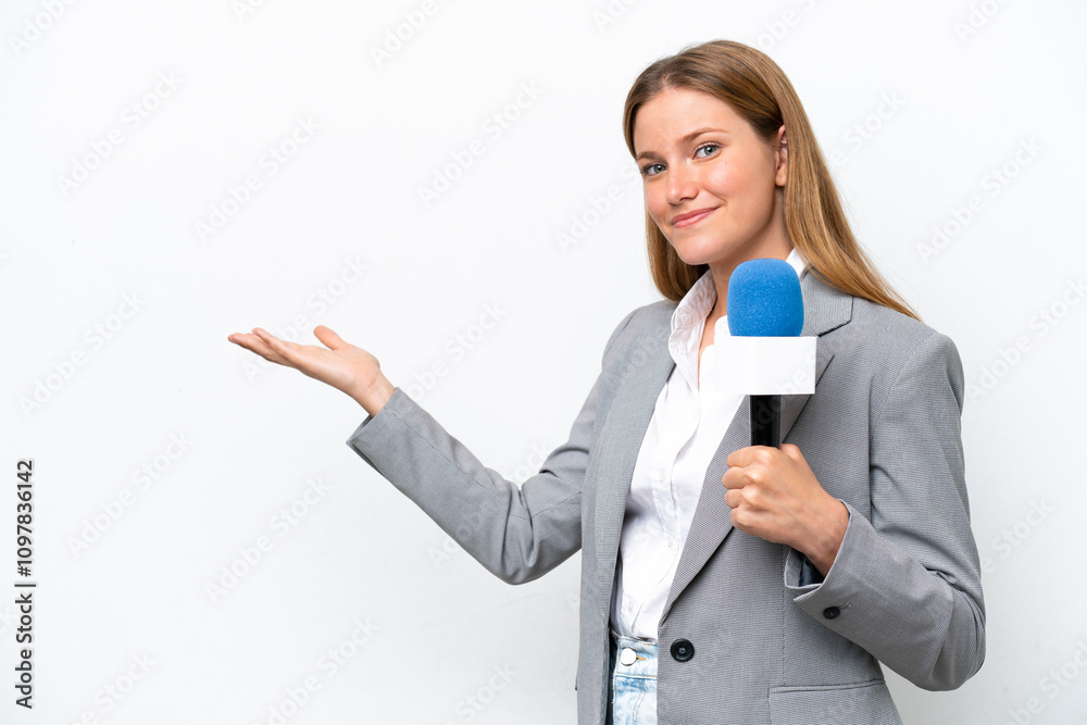 Young caucasian tv presenter woman isolated on white background extending hands to the side for inviting to come Young caucasian tv presenter woman isolated on white background extending hands to the side for inviting to come