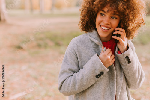 Cheerful young woman enjoyi...