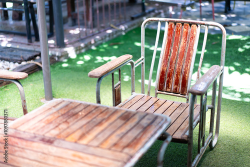 Wooden tables and chairs on the lawn for relaxing and unwinding in the restaurant. Focus on the point