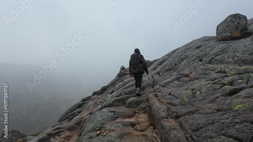 Hiking on a Foggy Mountain Slope