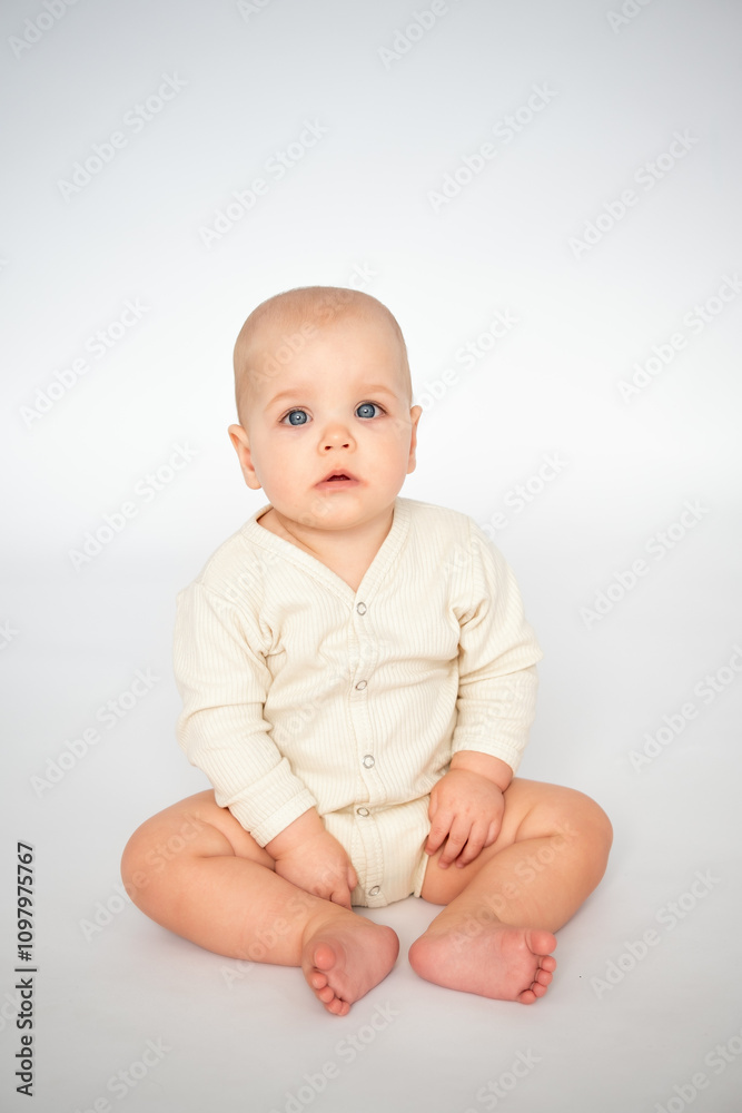 a baby on a white isolated background, a small child, a girl in light clothes, a place and space for text and advertising a baby on a white isolated background, a small child, a girl in light clothes, a place and space for text and advertising