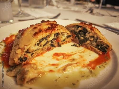 Obraz na płótnie Baked vegetable and béchamel crepe bundle (with tomato sauce) w salonie