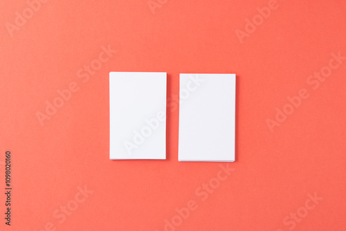 Mockup of white professional business cards on a pink background