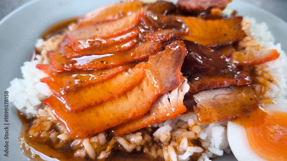 Red pork and crispy pork on rice, food in Thailand. Red pork and crispy pork on rice, food in Thailand.
