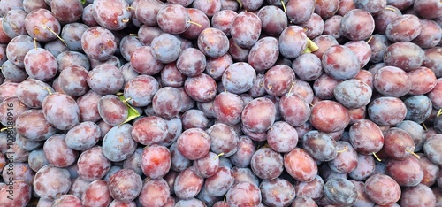 Plums in brown-red color for sale in a stall