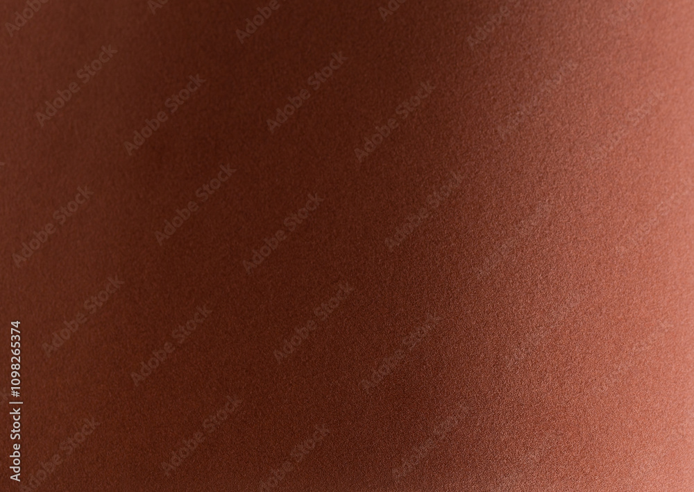 Fototapeta premium Terracotta velvet textured paper with a soft, matte surface. Elegant and luxurious design in a reddish brown monochrome tone. Perfect for modern, stylish backdrops, premium