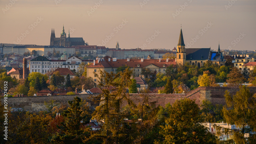 Fototapeta premium Autumn view of the Prague skyline and the castle from Vyšehrad at sunset. Colourful autumn in the park.