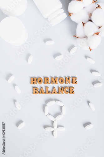 Obraz na płótnie Food supplements for restoring hormonal balance on a blue background top and vertical view w salonie
