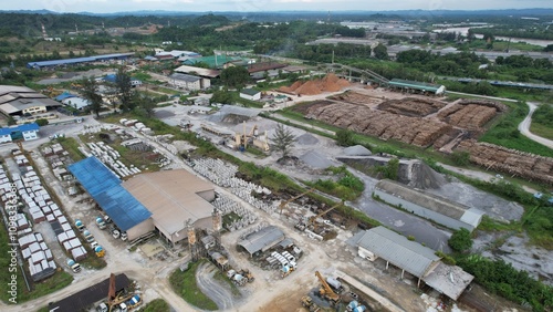 Bintulu, Malaysia - November 23, 2024: The Factories of Jepak Industrial Estate along Kemena River photo