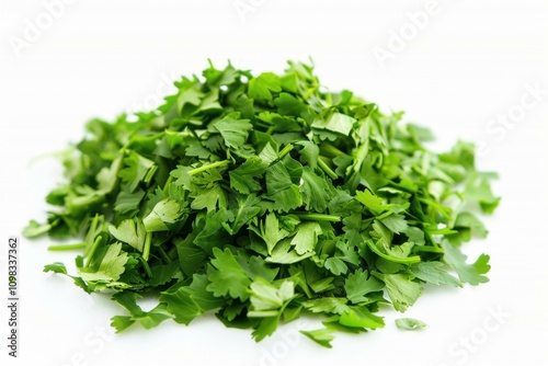 Fresh chopped parsley forming a small mound on white background photo