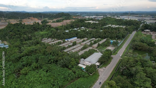 Bintulu, Malaysia - November 23, 2024: The Factories of Jepak Industrial Estate along Kemena River photo