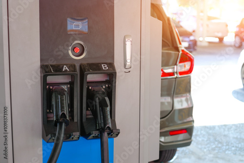 Wallpaper Mural Electric car public parking with charging station. Concept of the use of electric vehicles in a progressive lifestyle contributes clean and healthy environment. Torontodigital.ca