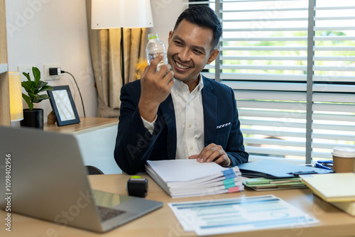 Businessman is feeling relaxed from fatigue during hard work photo