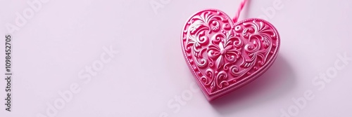 Shiny plastic pink ornate heart valentine with intricate designs and sparkling finish, ornate, pink photo