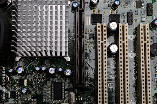 Electronic printed circuit board with SMD components, with chips, and cooling radiators photo