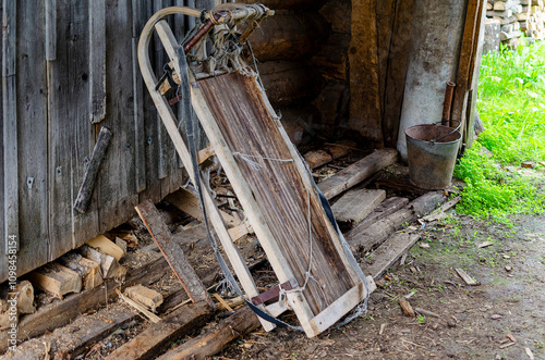 there is a wooden sleigh with a stretched rope. Wooden large sleigh for transportation.