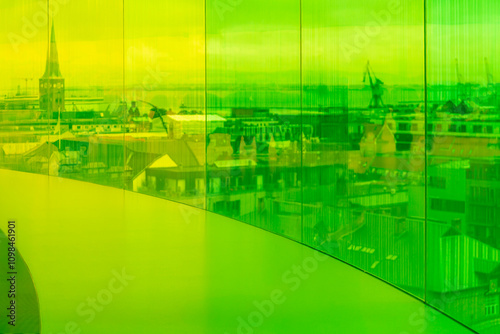 Distorted ,colored and blurry Aarhus cityscape through tinted glass panels. Denmark