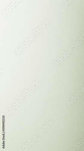 A plain, light green background with a subtle textured effect.