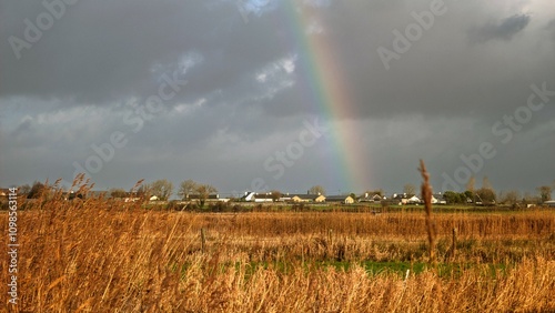 beautiful, landscape scenery with rainbow over Irish field at county Galway, Ireland, nature background