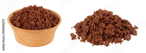 Dark muscovado sugar or Barbados sugar in wooden bowl isolated on white background photo