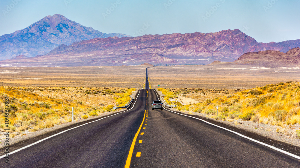 Route US 93 Alt in Nevada near Wendover. Pilot Peak and Leppy Peak provides a scenic backdrop in this remote environment.