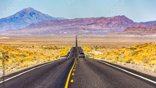 Route US 93 Alt in Nevada near Wendover. Pilot Peak and Leppy Peak provides a scenic backdrop in this remote environment. photo