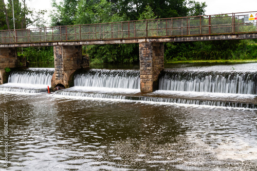 Water flowing over a weir bridge