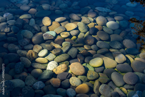 Multi-colored pebbles in the water