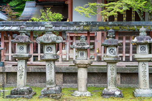 Tachi-doro japanese stone lanterns in a row at Todaiji Buddhist temple in Nara. photo