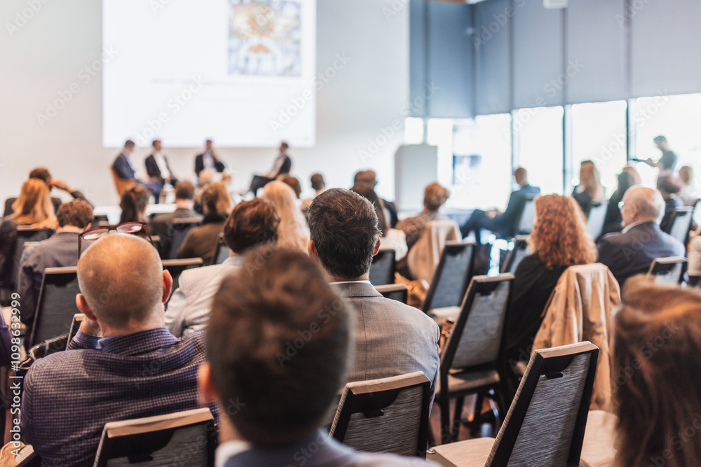 Obraz premium Interview and round table discussion at business convention and presentation. Audience at the conference hall. Business and entrepreneurship symposium.