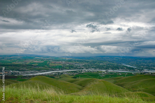 photo of the Lewiston Valley and Clearwater River taken from the Lewiston Hill with spring storm clouds in the background