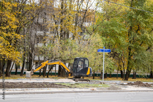 Wallpaper Mural Compact Excavator during excavation work at construction site. Mini Excavator digging the ground. Heavy earthmoving equipment Torontodigital.ca