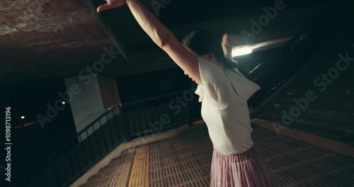 Asian woman, night and dancer with motion for street performance, kpop or choreography style in Japan. Japanese, female person or ballerina with fashion for ballet, fast dancing or time lapse in city photo